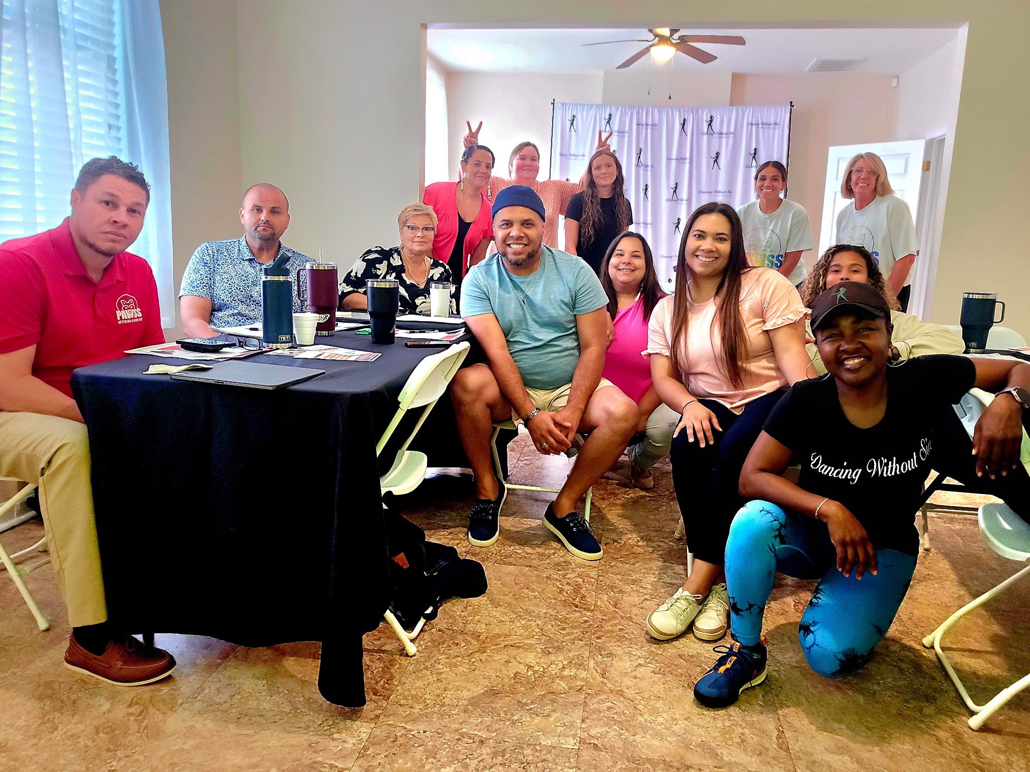 PAWSS team and community members at a group meeting