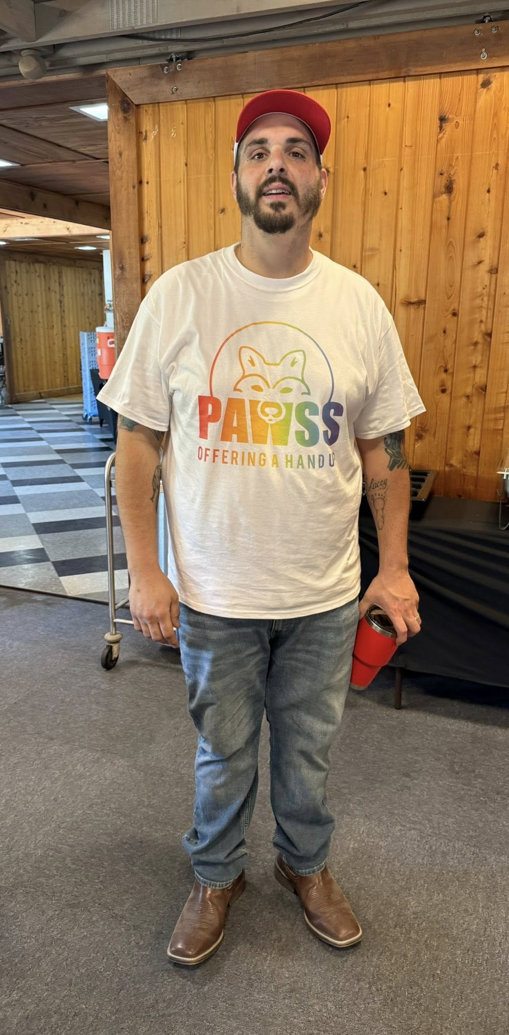 PAWSS team member in branded shirt