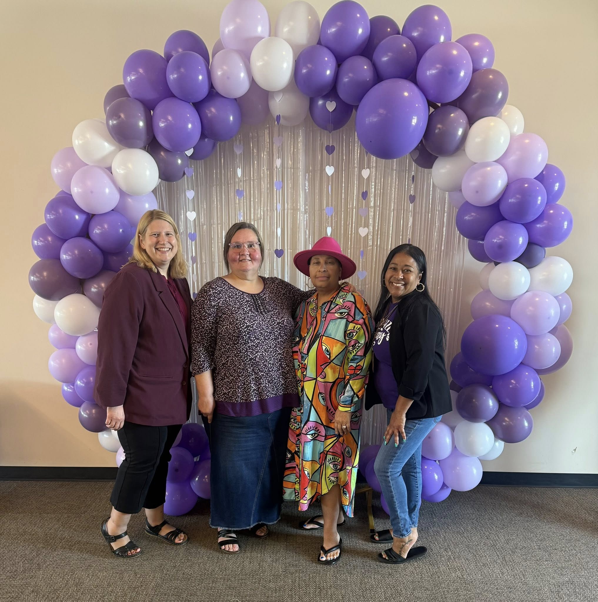 Four members at a community celebration event