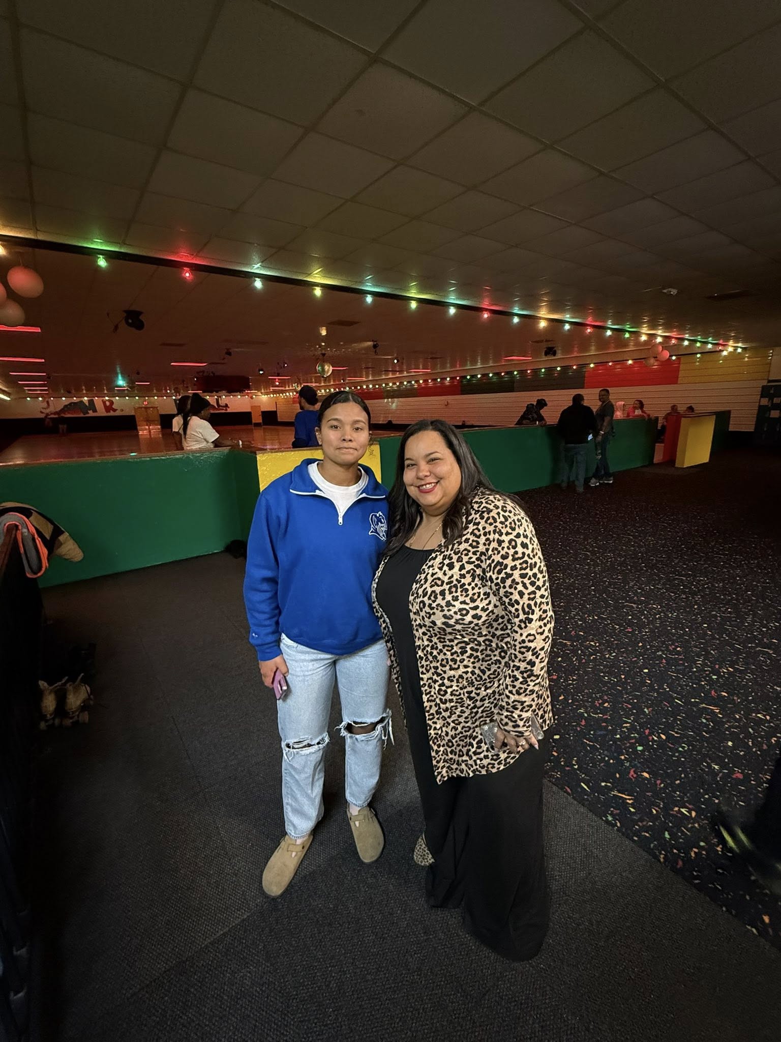 Community members at skating rink event